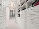Well-organized walk-in closet featuring custom shelves and ample storage space at 29 Cliftwood Dr, Sandy Springs, GA 30328