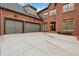 The brick home features a two-car garage and covered entry at 29 Cliftwood Dr, Sandy Springs, GA 30328