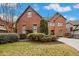Beautiful brick home with manicured landscaping and a well-maintained lawn at 29 Cliftwood Dr, Sandy Springs, GA 30328