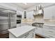 Modern kitchen features stainless steel appliances, quartz countertops, and ample cabinet space at 29 Cliftwood Dr, Sandy Springs, GA 30328