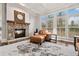 This bright living room has large windows with plantation shutters and hardwood floors at 29 Cliftwood Dr, Sandy Springs, GA 30328