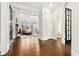 Spacious living room with dark hardwood floors, a coffered ceiling, and a view to the fireplace at 29 Cliftwood Dr, Sandy Springs, GA 30328