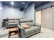 Home theater room with projector, barn doors, and plush seating at 29 Cliftwood Dr, Sandy Springs, GA 30328