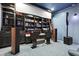 Home theater with black built-in shelves and speakers at 29 Cliftwood Dr, Sandy Springs, GA 30328