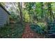 View of a backyard featuring a rustic walking path and lush natural vegetation at 3151 Rilman Nw Rd, Atlanta, GA 30327