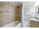 Bathroom featuring a tub, shower with tiled walls, patterned tile floor and updated vanity at 3151 Rilman Nw Rd, Atlanta, GA 30327