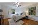 Cozy bedroom features two windows and hardwood floors, creating a bright and airy space at 3151 Rilman Nw Rd, Atlanta, GA 30327