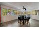 Enclosed sunroom featuring a tile floor, ceiling fan, and lots of natural light at 3151 Rilman Nw Rd, Atlanta, GA 30327