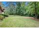 Lush green backyard with mature trees creating a private and serene setting at 1007 E Callaway Sw Rd, Marietta, GA 30060