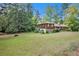 Exterior of a charming two story home with a large front yard at 1007 E Callaway Sw Rd, Marietta, GA 30060