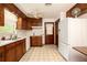 Functional kitchen with traditional wood cabinets and white appliances at 1007 E Callaway Sw Rd, Marietta, GA 30060