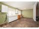 Spacious kitchen with worn cabinets and a rocking chair at 1007 E Callaway Sw Rd, Marietta, GA 30060