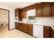 Functional kitchen featuring wood cabinets and a white dishwasher at 1007 E Callaway Sw Rd, Marietta, GA 30060