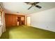 Spacious living room with retro carpet and wood paneling at 1007 E Callaway Sw Rd, Marietta, GA 30060