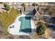 Aerial view of a backyard featuring a large pool and cabana near mature trees and landscaping at 1331 Dayspring Trce, Lawrenceville, GA 30045