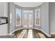 Bright breakfast nook with large windows, French doors, and hardwood floors at 1331 Dayspring Trce, Lawrenceville, GA 30045