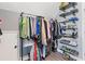 Organized walk-in closet features built in shoe racks and ample hanging storage at 1331 Dayspring Trce, Lawrenceville, GA 30045