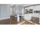 Kitchen featuring a gray color scheme, a large central island with seating and stainless steel appliances at 1331 Dayspring Trce, Lawrenceville, GA 30045