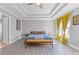 Bright main bedroom featuring neutral walls, a ceiling fan, and modern decor at 1331 Dayspring Trce, Lawrenceville, GA 30045