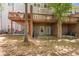 Backyard view of decks and patios on the rear of the home and lower level entrances at 1552 Mosaic Way, Smyrna, GA 30080