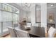 Elegant dining room features a chandelier, large window, and neutral color palette at 1552 Mosaic Way, Smyrna, GA 30080