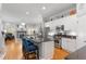 Open kitchen layout with island seating flows seamlessly into the adjacent living area at 1552 Mosaic Way, Smyrna, GA 30080