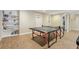 Recreation space with a ping pong table and a bookshelf at 1085 Highland Crest Ct, Mableton, GA 30126