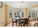 Inviting breakfast nook with views of the screened in porch and backyard at 1085 Highland Crest Ct, Mableton, GA 30126