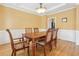 Traditional dining room with hardwood floors, wainscoting, and a decorative ceiling at 1085 Highland Crest Ct, Mableton, GA 30126