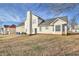 This backyard features a grassy lawn and a two-story house at 6153 Idlewood Pass, Lithonia, GA 30038