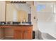 This bathroom features a sink, a mirror, a window, and a bathtub at 6153 Idlewood Pass, Lithonia, GA 30038