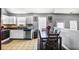 Bright kitchen and dining area with white cabinets and stainless steel appliances at 6153 Idlewood Pass, Lithonia, GA 30038