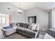 Spacious living room with high ceilings, a large sectional, and abundant natural light at 6153 Idlewood Pass, Lithonia, GA 30038