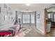 This room features a bay window, carpet, and a daybed with a pink blanket and rug at 6153 Idlewood Pass, Lithonia, GA 30038