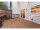 Back deck with brown wood and string lights, leading to a sliding glass door at 1152 Liberty Nw Pkwy, Atlanta, GA 30318