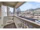 View from the balcony of a well-maintained street with sidewalks and colorful townhomes at 1152 Liberty Nw Pkwy, Atlanta, GA 30318