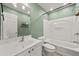 Bathroom featuring a tub, toilet, sink, and large mirror at 1152 Liberty Nw Pkwy, Atlanta, GA 30318