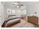 Well-lit bedroom with hardwood floors, ceiling fan and office nook at 1152 Liberty Nw Pkwy, Atlanta, GA 30318