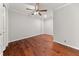 Spacious bedroom with hardwood floors and a ceiling fan at 1152 Liberty Nw Pkwy, Atlanta, GA 30318