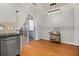 Bright dining area with stainless steel dishwasher, sliding door access to back deck, and modern lighting fixture at 1152 Liberty Nw Pkwy, Atlanta, GA 30318