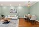 Stylish living area features hardwood floors, modern decor, neutral paint, and a comfortable white couch at 1152 Liberty Nw Pkwy, Atlanta, GA 30318