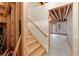 Unfinished basement with wooden stairs and exposed beams, offering potential for customization and storage at 144 Fox Creek Dr, Woodstock, GA 30188