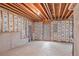 Unfinished basement with concrete floor, insulated walls, and natural light, offering a blank canvas for customization at 144 Fox Creek Dr, Woodstock, GA 30188