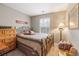 Bedroom with a window with neutral colored walls, and light hardwood flooring at 144 Fox Creek Dr, Woodstock, GA 30188