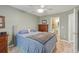 Bedroom with ceiling fan and en-suite bathroom featuring a modern vanity and lighting at 144 Fox Creek Dr, Woodstock, GA 30188