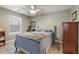 Bedroom with ceiling fan, a neutral colored walls, and light hardwood flooring at 144 Fox Creek Dr, Woodstock, GA 30188