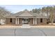 Attractive community clubhouse with covered entrance, offering residents a gathering and recreational space at 144 Fox Creek Dr, Woodstock, GA 30188