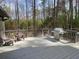 Back deck with a stainless steel BBQ grill and wooded views at 2690 Twin Creek Ct, Marietta, GA 30062