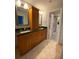 Bathroom with dual sink vanity, granite countertops, and custom wood cabinets at 2690 Twin Creek Ct, Marietta, GA 30062