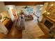 Bright and airy living room featuring hardwood floors, a stone fireplace, and large windows at 2690 Twin Creek Ct, Marietta, GA 30062